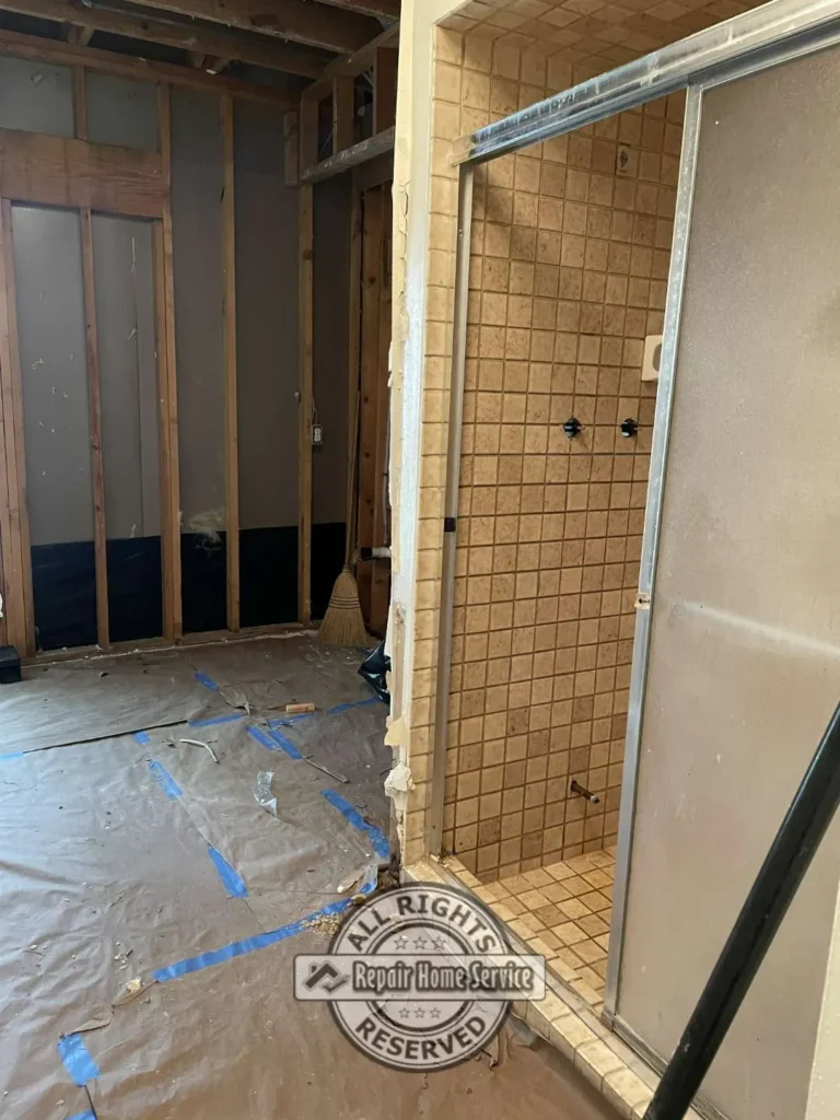 Bathroom remodel overview with newly installed shower tile, vanity area, and updated finishes in Cypress TX