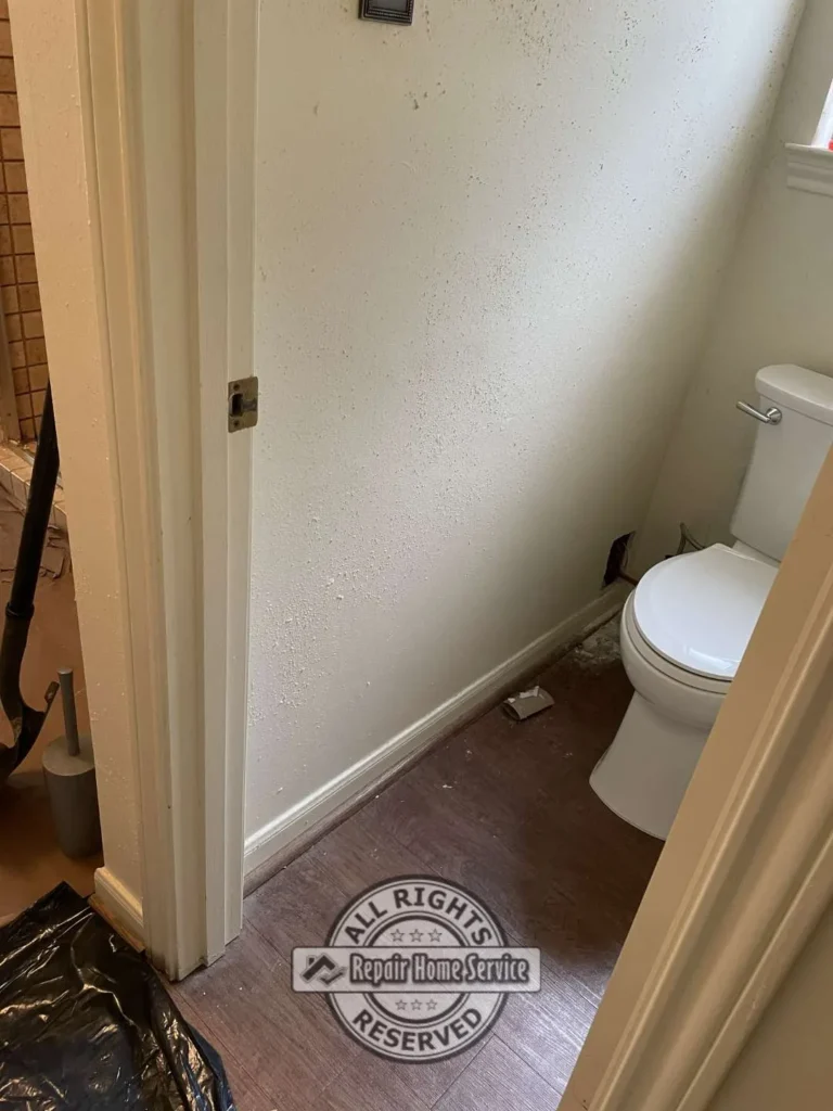 Bathroom renovation in progress with floor preparation and demolition cleanup in Cypress TX