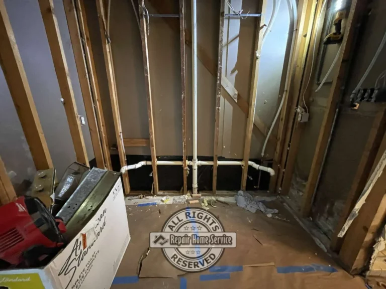 Custom Roman-style bathtub demolition with exposed framing and plumbing during bathroom renovation in Cypress Texas