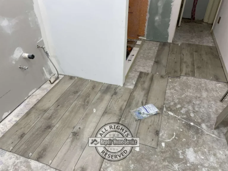 Bathroom remodeling detail showing tile alignment and finish carpentry work in Houston Texas