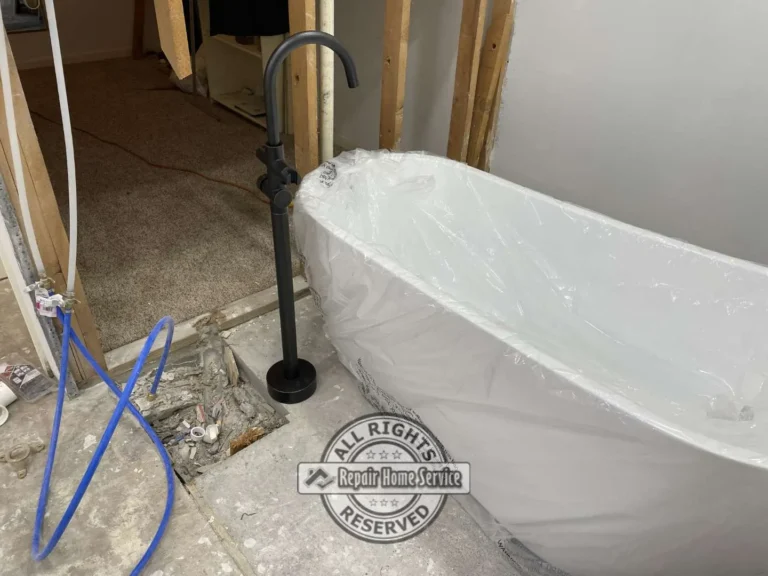 Completed freestanding bathtub installation with modern bathroom finishes in Cypress TX