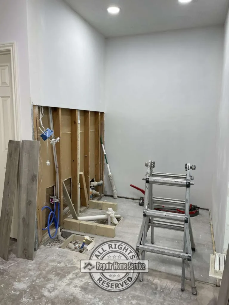 Bathroom shower remodel with large format tile installation and modern fixture preparation in Houston Texas