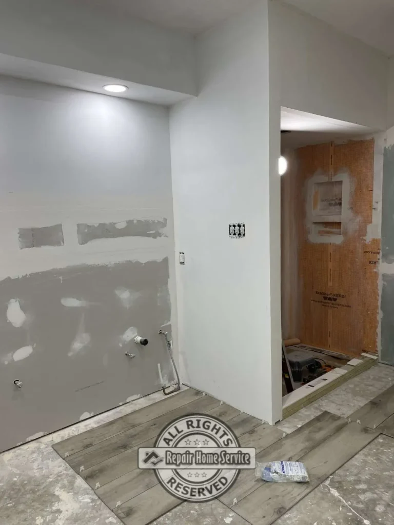 Bathroom vanity installation with updated countertop and lighting improvements in Houston TX