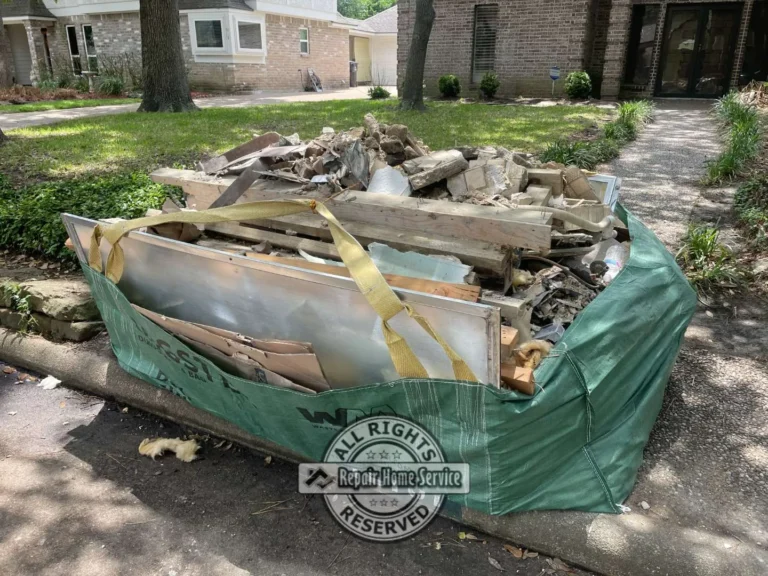 Dumpster bag filled with demolition debris during bathroom renovation cleanup in Houston TX