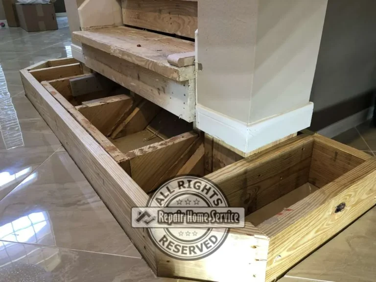 Structural lumber framing for a custom bottom stair platform built around a square column before Red Oak tread installation in a Cypress TX home.