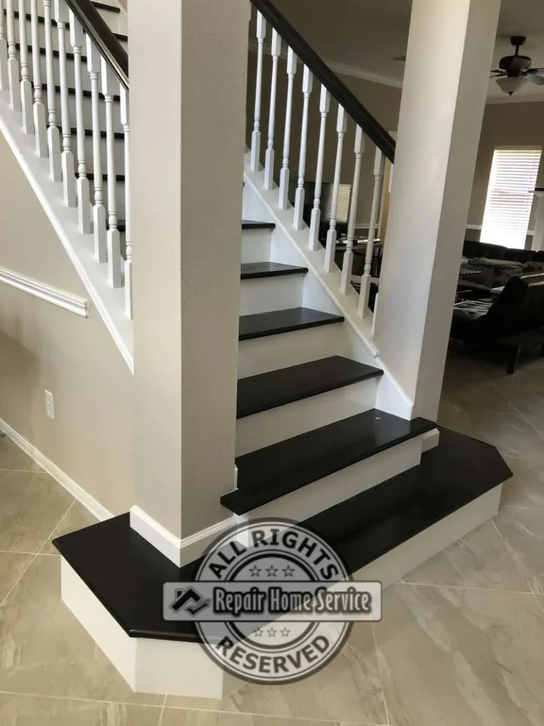 Finished Black Coffee Red Oak stair treads with glossy topcoat, white maple risers, and matching stained handrail on white balusters in a Cypress TX living area.