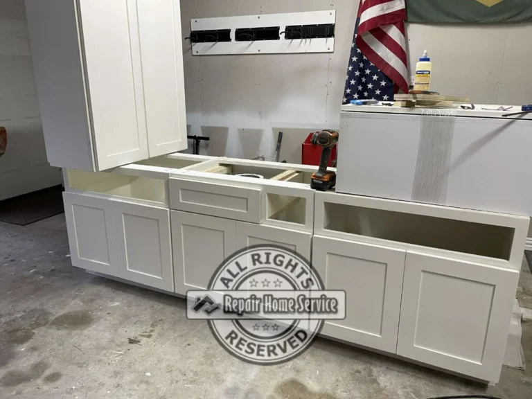 Custom craft room cabinet boxes assembled in shop with white primed shaker doors, drawer fronts, and upper cabinet units ready for on-site install in Cypress TX.