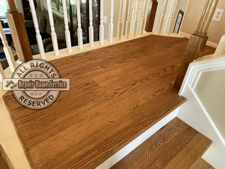Completed lower stair section in Houston TX with solid red oak treads, white maple risers, and clean glue-down finish after remodel