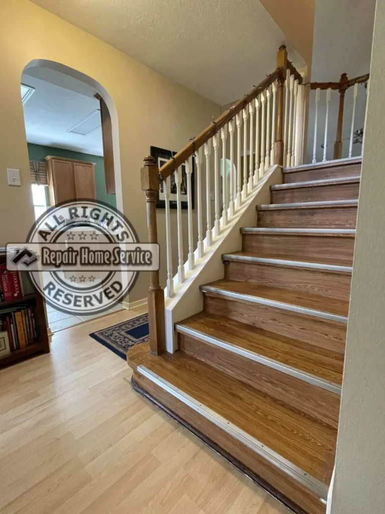 Close-up before photo of dated stair treads and risers in Houston TX residence prior to red oak and maple replacement
