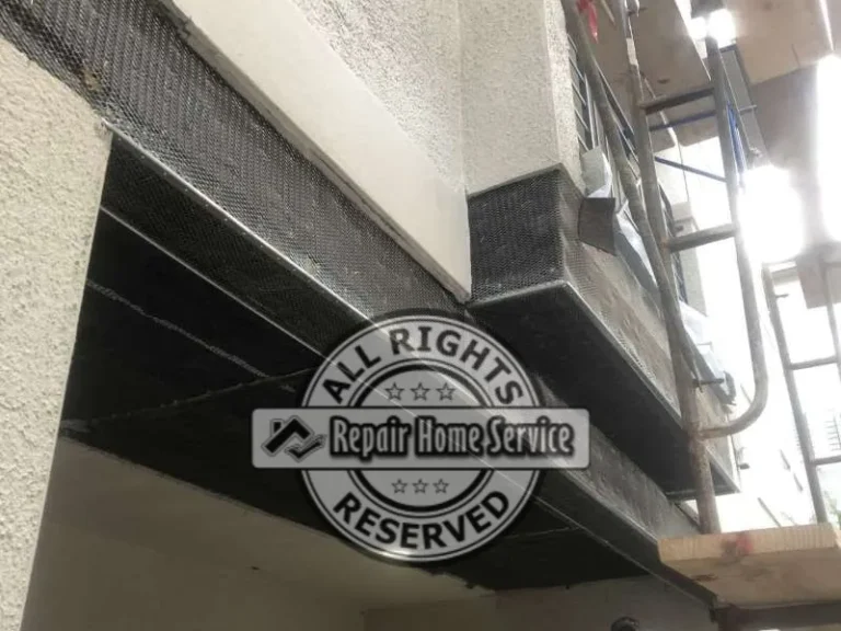 Newly finished porch beam coated and sealed following stucco repair and exterior waterproofing work.