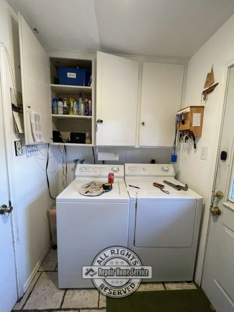 Custom floor-to-ceiling cabinet framework under construction inside Houston laundry room with open shelving layout.