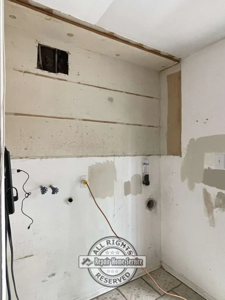 Built-in cabinet carcass installation showing custom shelving compartments prior to door installation and finishing.