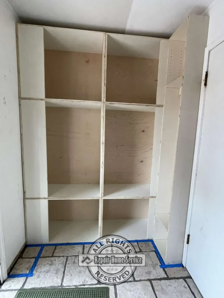 Completed custom laundry room storage cabinets with shaker-style doors and floor-to-ceiling design in Houston TX.