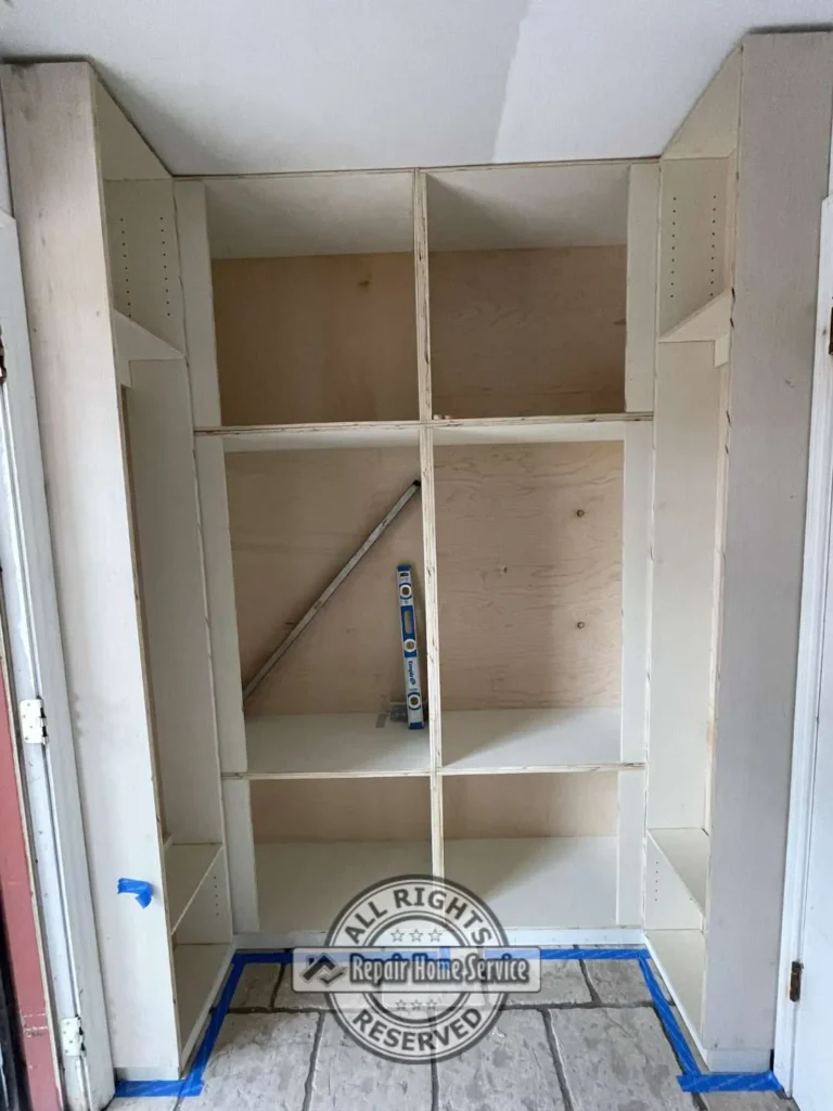Interior view of custom storage cabinet showing adjustable shelving and pull-out storage components.