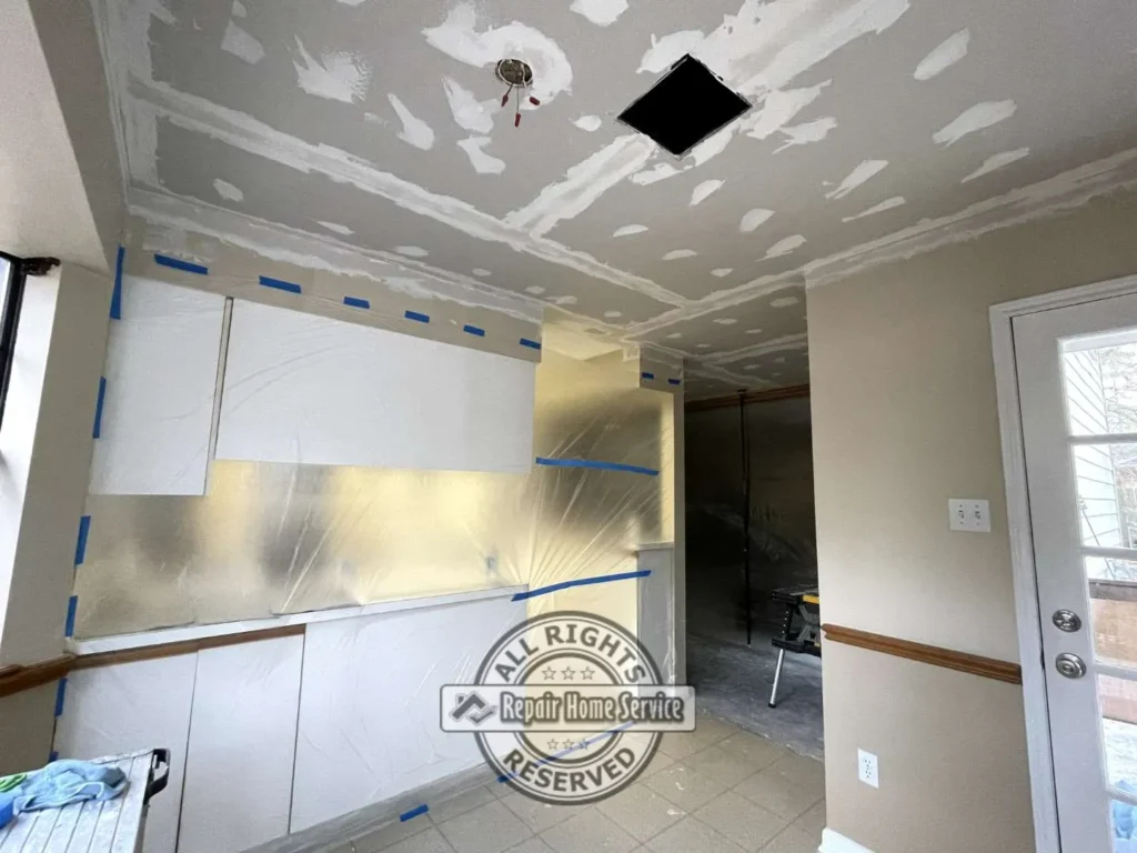Finished ceiling surface after restoration and drywall blending work completed in Houston TX residential interior.
